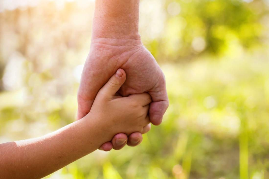 Parent-holding-childs-hand